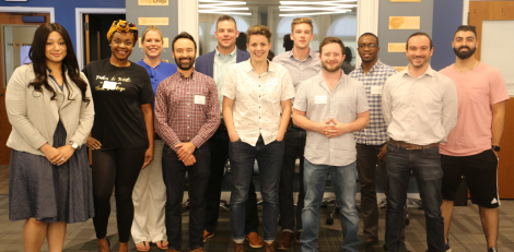 Group of IgniteU employees and program members smiling for the camera